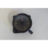 WWII aircraft 8 day clock, the back stamped AM with crown, the dial with setting knob for time of