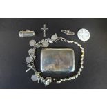 A silver charm bracelet, a silver bracelet, an enamel locket brooch and crucifix, and a silver