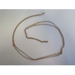 A 9ct yellow gold long chain with fob watch clip approx 150cm long, approx 21 grams, generally good,