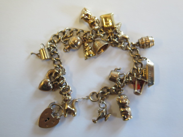 A 9ct gold charm bracelet, approx 32 grams