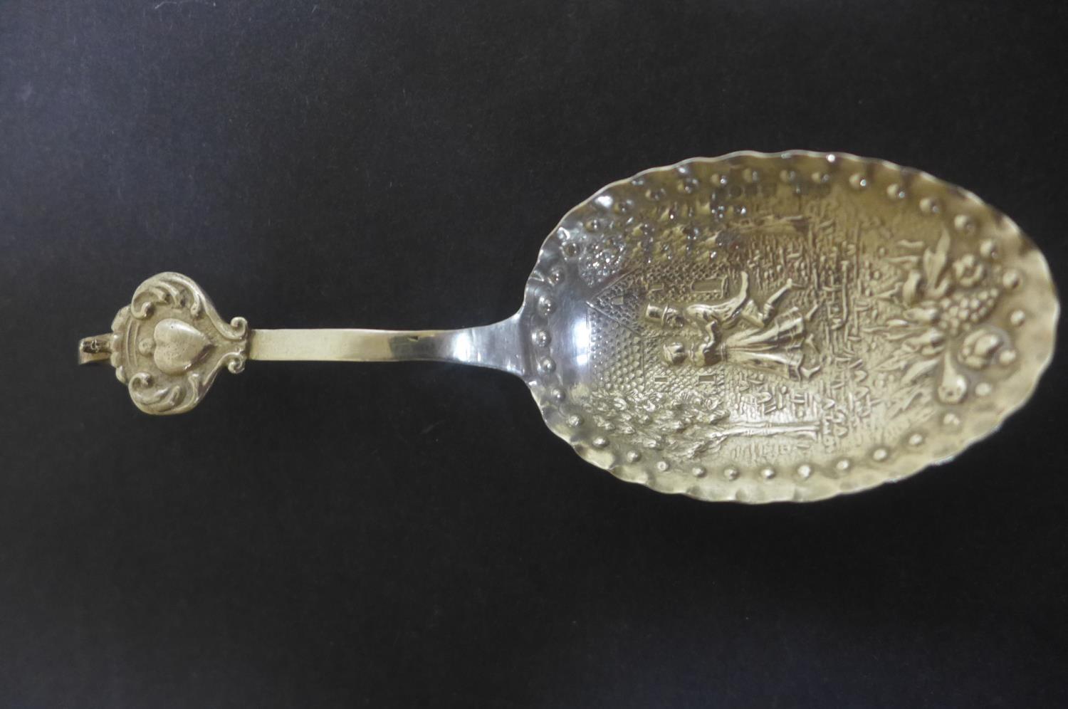 A large caddy spoon with continental hallmarks and later English hallmarks, London 1896 sponsor