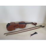 A violin with a one piece 14 1/8 inch back, no label, needs some restoration, and two un-named bows