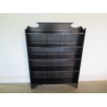 An oak open book case - 125cm tall x 92cm x - in good polished condition