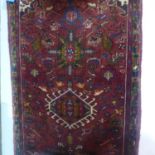 A hand knotted woollen Heriz runner - 390cm x 90cm