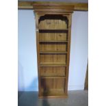 A modern pine bookcase, 210cm H x 77cm W x 28cm D