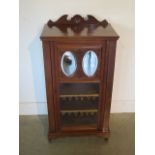 A Victorian mahogany cabinet with a mirrored glazed door, 102cm tall x 54cm x 35cm