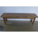 A rustic pine bench, measures 158cm length, 48cm height, depth 33cm
