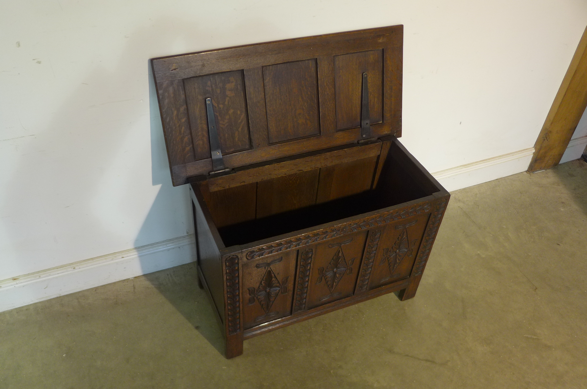 A 17th century style carved oak panelled coffer, 59cm tall x 91cm x 44cm - in good polished - Image 2 of 4