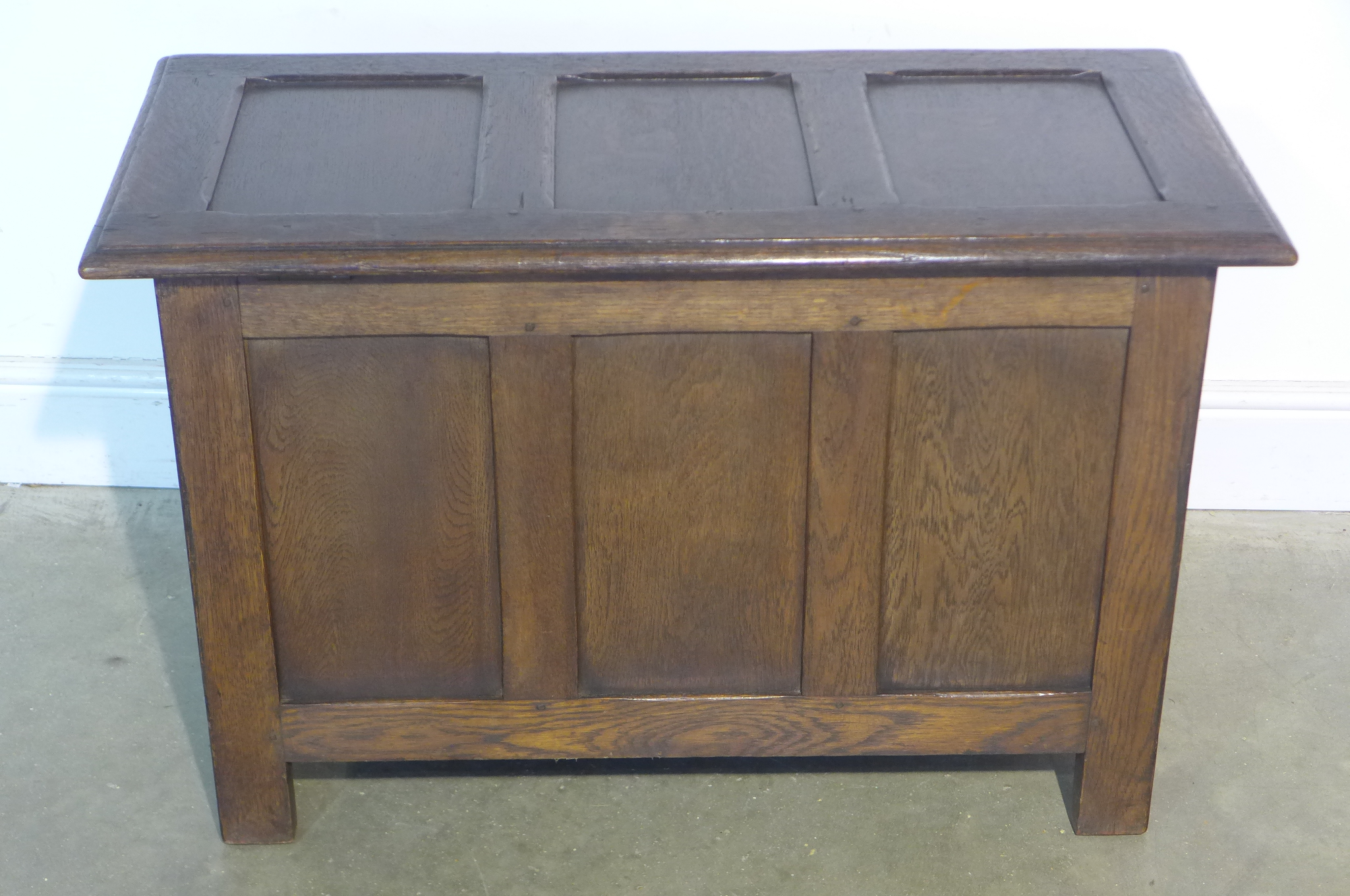 A 17th century style carved oak panelled coffer, 59cm tall x 91cm x 44cm - in good polished - Image 4 of 4