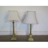 Two brass column table lamps approx 88cm tall with shades, will need re-wiring