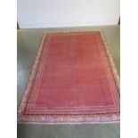 A hand knotted woollen Araak rug - 293cm x 194cm