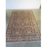 A hand knotted woollen Kashan rug - 294cm x 198cm