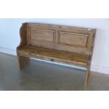 A rustic pine pew with fielded panel back, length 139cm, back height 91cm, seat height 45cm, depth