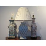 Three chinoiserie table lamps, all will need re-wiring, one has a repaired top, one with shade is