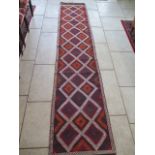 A hand knotted woollen Old Suzni Kilim runner - 332cm x 68cm