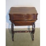 A 19th century style mahogany work box, 75cm tall x 54cm x 36cm