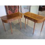 A pair of walnut D shaped side tables with a single drawer on turned reeded legs, made by a local