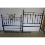 A Victorian brass and iron 4foot 6inch double bed, with side irons - headboard is 62 inches tall