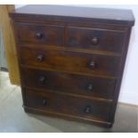 A Victorian mahogany chest with two short over three long drawers, 111cm tall x 102cm x 47cm