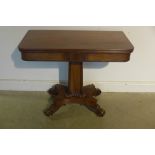 A late Regency/William IV flame mahogany fold over top tea table with concave tapering four sided