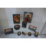 A collection of six Russian paper mache boxes, three brooches and an icon