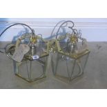 A pair of brass hanging lantern lamps, 31cm tall