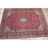 A hand knotted woollen Kashan rug - 342cmx 254cm