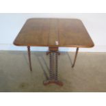 A 19th century walnut Sutherland table on turned supports, 92cm wide, 82cm long