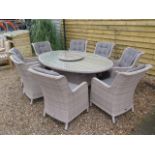 A Bramblecrest Blenheim 220cm elliptical table with lazy Susan and eight armchairs, ex-display