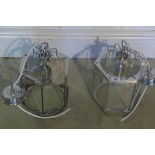 A pair of chrome hanging lantern lights