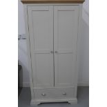 A Furniture Village light grey painted double wardrobe with a base drawer, 196cm H x 97cm W x 58cm D