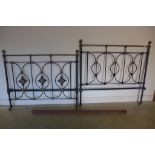 A Victorian brass and iron 4 foot 6 inches double bed with side irons headboard is 54 inches tall