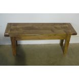 A small rustic pine bench, length 103cm, height 44cm, width 33cm