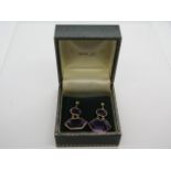 A large pair of 18ct gol and amethyst drop earrings stamped 750 and with Italian hallmarks for