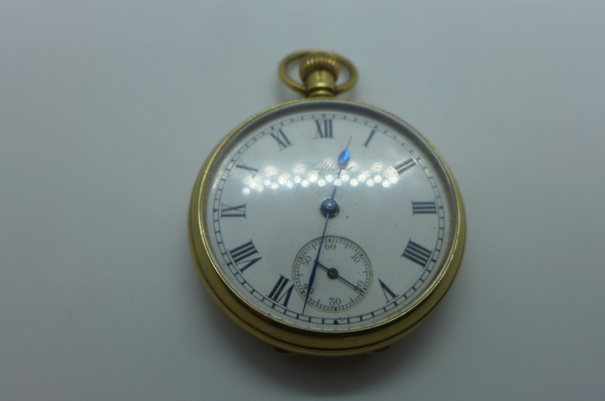 A 9ct gold Waltham packet watch with white enamel face, case and dust cover fully hallmarked,