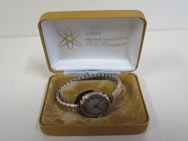 A 9ct manual wind wristwatch on a plated strap, total weight approx 20 grams, running in saleroom