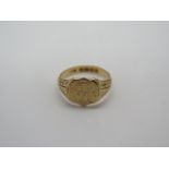 A gents 18ct gold signet ring, hallmarked Birmingham 1916 - monogram engraved and decorated