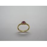 A 9ct yellow gold ruby and diamond rig, size J/K approx 2.2 grams, ruby has not been tested to be