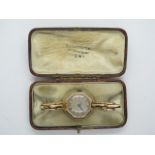 A ladies 9ct gold wristwatch on a 9ct sprung strap, running, hands advance, total weight approx 18