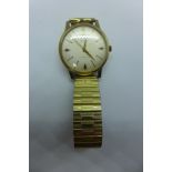 A 9ct gold Avia De Luxe automatic gents wristwatch, case 35mm wide, on a plated strap, some