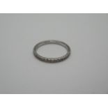 A 950 platinum and diamond ring, size M, approx 1.3 grams, some usage marks but generally good,