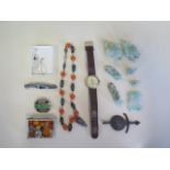An assorted lot of jewellery, a Roamer watch, not working and jadeite figures