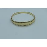 A hallmarked 9ct gold bangle, approx 12 grams, 6x6.5cm - generally good, some small usage marks