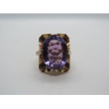 A 9ct gold and amethyst Art Nouveau style ring, set with a large oval amethyst measuring approx 15mm