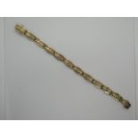 A gold and diamond bracelet with eleven coffin shape links and clasp, all set with a diamond