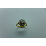 An 18ct yellow gold diamond cluster ring, size N/O, cluster is 10mm approx 3.7 grams, marked