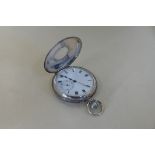 A silver half hunter top wind pocket watch with Swiss 15 jewel movement, hallmarked London 1913 -