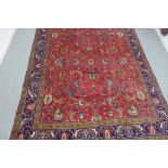 A hand knotted woollen Tabriz rug - 380cm x 300cm