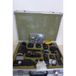 A Canon A-1 35mm Camera kit, with four lenses in a fitted carry case