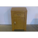 An oak bedside cabinet, 75cm tall x 50cm x 35cm